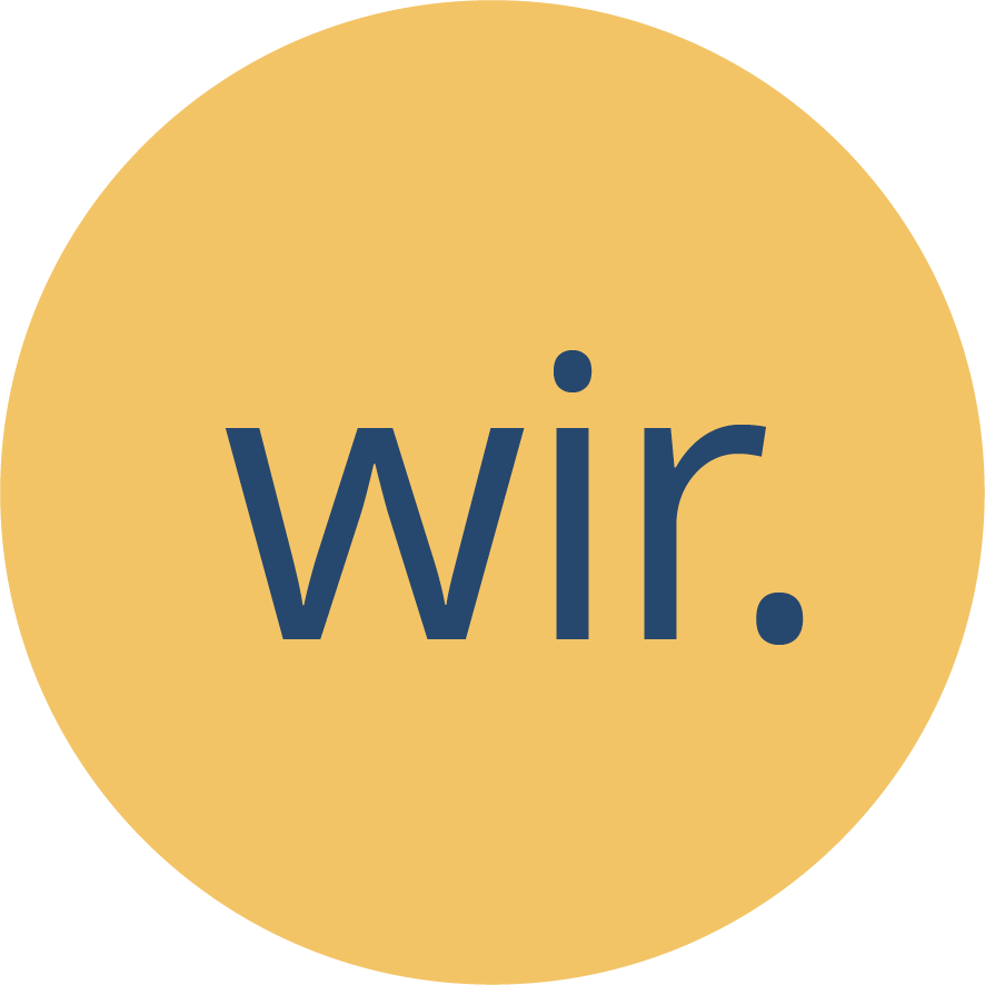 Ein weisser Kreis in dem das Wort "wir" steht, das Element dient zur Navigation auf der Webseite.